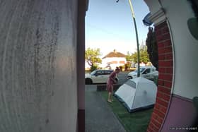 Video grab of the moment a mum was baffled when she looked outside and found a stranger had pitched a tent in her front garden overnight