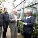 Paul Rees, Nursery Manager; Alex Baribeau, Tropical Nursery Supervisor; Sir David and Dr Sonia Haoa Cardinali. Credit: Jeff Eden © RBG Kew