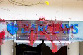 All the windows of the Barclays Bank branch in the centre of Bristol have been smashed and graffiti sprayed over them in a co-ordinated attack by a group targeting the bank. 