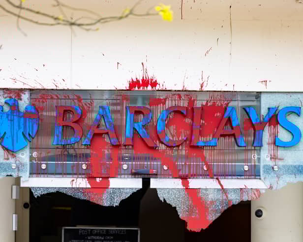 All the windows of the Barclays Bank branch in the centre of Bristol have been smashed and graffiti sprayed over them in a co-ordinated attack by a group targeting the bank. 