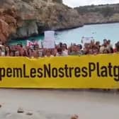 Majorca anti-mass tourism protesters ‘occupy’ beach.