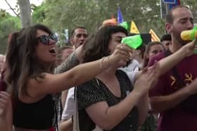 Anti-mass-tourism protesters squirt diners with water guns in Barcelona, Spain.
