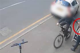 Phone thief cycles past victims before snatching their phones.