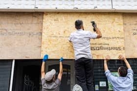Shops on Old Market Road and West Street in Bristol board up their windows and close early amid planned far-right protests.