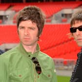Oasis band members Noel (left) and Liam Gallagher are pictured during a photo call at Wembley Stadium. 