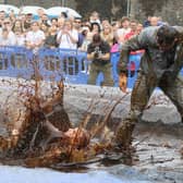 Hundreds of revellers descended on a pub garden to watch the 'world gravy wrestling championships.' 