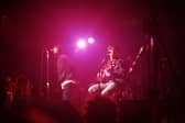Liam Gallagher and Noel Gallagher of Oasis perform on stage at The Electric Ballroom, Camden on May 9 1996 (Photo by Getty Images) 