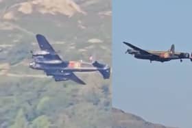 Second World War-era Avro Lancaster Bomber flies over lake.