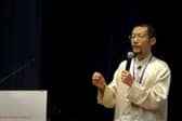 A video grab of Hongchi Xiao conducting a presentation on Paida Lajin therapy.