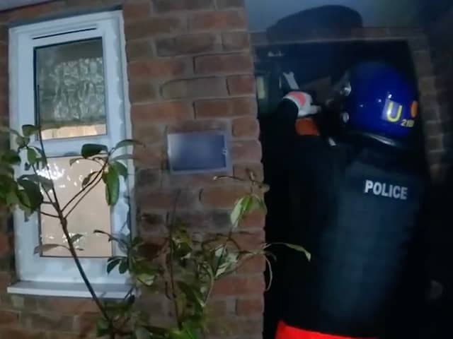 Body worn footage shows officers before a raid on a suspected gangster's home in West Midlands. 