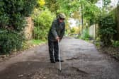 Furious resident Douglas Debnam on Whitebarns Lane in the village of Furneaux Phelham in Hertfordshire, is embroiled in Britain's longest running pothole row.