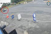 Man falls from car after clinging on after bag theft.