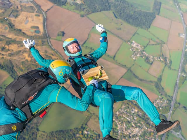 Parachuters performed mid-air manoeuvres which saw the bright turquoise liquid shaken and stirred from heights up to 10,000ft