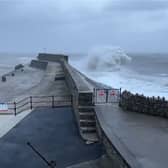 Huge waves crash into Porthcawl pier.