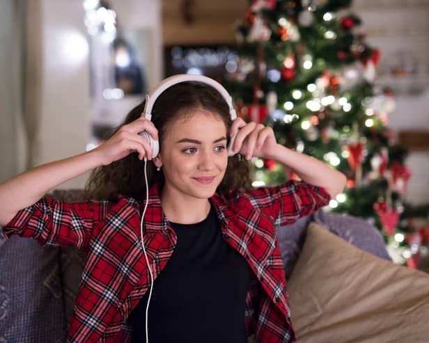 Woman listening to Christmas music.