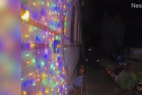 Video grab of a man snipping the Christmas lights at a property in Suffolk. 