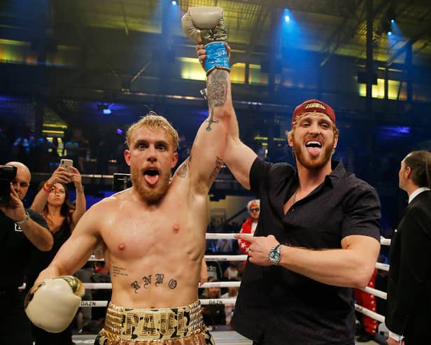 Jake Paul (left) and Logan Paul (right) have faced opponents in the ring over the years, but new social media posts have fans thinking a brotherly brawl could be on the cards. 