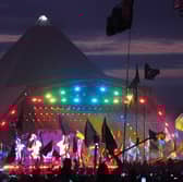 The crowd watching Coldplay performing on the Pyramid Stage at the Glastonbury Festival