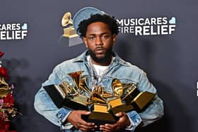 Kendrick Lamar poses with the Record Of The Year, Best Rap Performance, Song Of The Year, Best Music Video, Best Rap Song awards in the press room during the 67th Annual Grammy Awards.     
