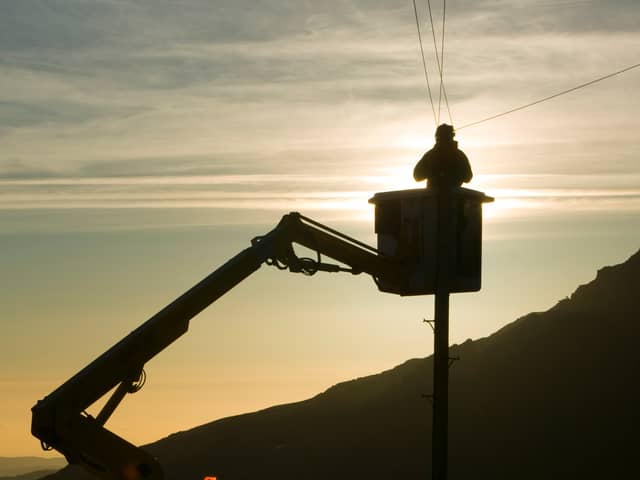 A BT worker fixs telephone lines (Photo: Ashley Cooper/Construction Photography/Avalon/Getty Images)