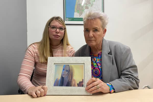 Katie Brett and Lorraine Beavers with a photo of Sasha Marsden.