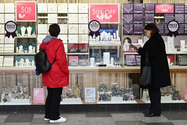 Two women look at a jewellery shop window in Stevenage, north of London, in 2024 (Photo: JUSTIN TALLIS/AFP via Getty Images)