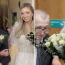 Maurice Haynes walks his daughter Hannah Haynes down the aisle.