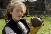 Magnet Fishing Edinburgh's Eryn and the 350-year-old cannonball found in the River Lochy in the Scottish Highlands. 