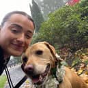 Rebecca McBride, chaperoning a dog.