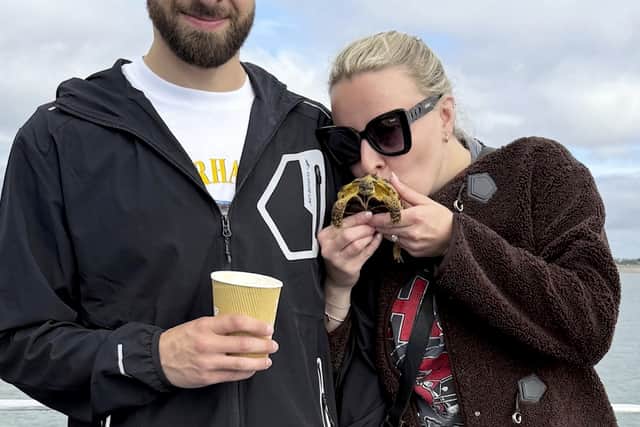 A couple made their special day a little extra special by including their pet tortoise in the wedding procession.