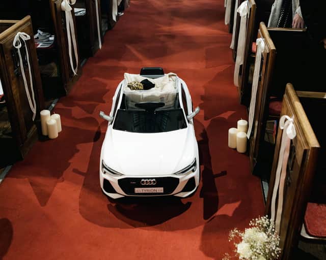 Charlotte and Joe Dawson, had their pet tortoise, Tyrion, five, roll down the aisle in style as one of Joe's groomsmen.