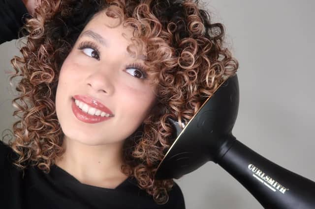 The Curlsmith Defrizzion Hair Dryer includes an extra-large diffuser designed to help define curls while reducing frizz