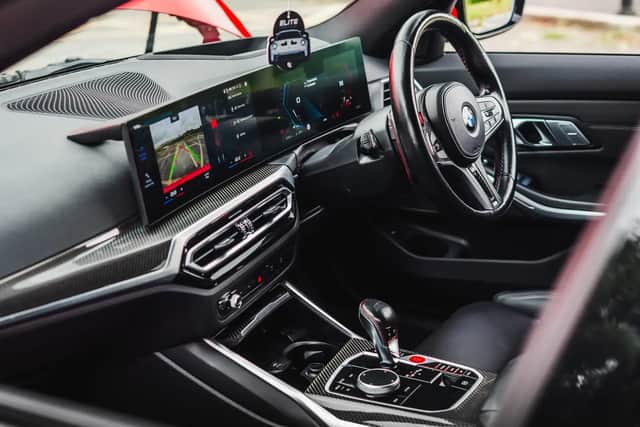 The BMW M3 Touring interior includes full black Merino leather, illuminated headrests, carbon trim and a Harman/Kardon sound system