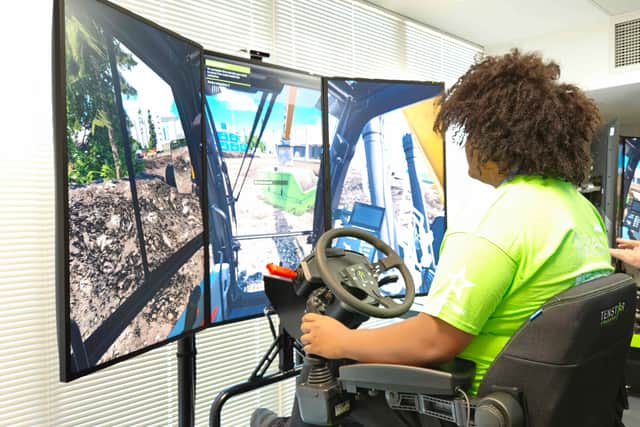 Students were able to use high-tech simulators to try working on a construction project.