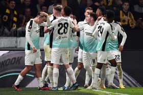 Joao Pedro of Brighton & Hove Albion (obscured) celebrates with teammates after scoring the team's first goal from the penalty spot during the UEFA Europa League 2023/24 match betweek AEK Athens FC and Brighton & Hove Albion on November 30, 2023 in Athens, Greece. (Photo by Milos Bicanski/Getty Images)