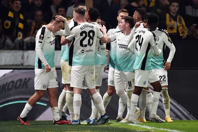Joao Pedro of Brighton & Hove Albion (obscured) celebrates with teammates after scoring the team's first goal from the penalty spot during the UEFA Europa League 2023/24 match betweek AEK Athens FC and Brighton & Hove Albion on November 30, 2023 in Athens, Greece. (Photo by Milos Bicanski/Getty Images)