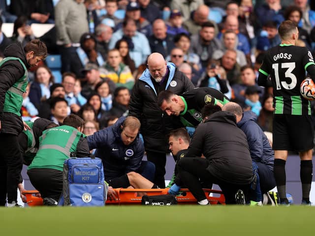 Solly March leaves the field on a stretcher after receiving medical treatment during the Premier League match between Manchester City and Brighton & Hove Albion at Etihad Stadium on October 21, 2023 in Manchester, England. (Photo by Charlotte Tattersall/Getty Images)