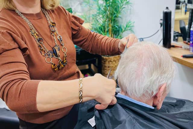 Bernard Sunley's Hairdresser, Anna Detira with resident, Ken McLaren