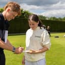 Ollie Pope signs a bat for a Cranleigh player | Contributed picture