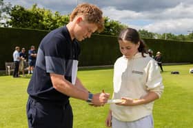 Ollie Pope signs a bat for a Cranleigh player | Contributed picture