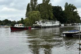 Boat being towed away by joint enforcement in Molesey, Elmbridge. (Credit: Cllr Kevin Whincup)