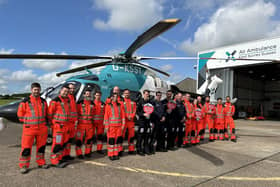 Doctors, paramedics and pilots from KSS celebrating the success of the appeal to buy the helicopter