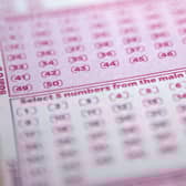 A mystery woman, known only as Miss C from Surrey, has won £10,000 a month for one year after matching the five main numbers in the Set For Life draw. Picture by SHAUN CURRY/AFP via Getty Images