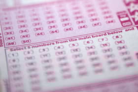 A mystery woman, known only as Miss C from Surrey, has won £10,000 a month for one year after matching the five main numbers in the Set For Life draw. Picture by SHAUN CURRY/AFP via Getty Images