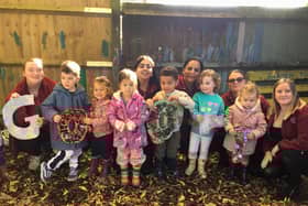 Children and team members at The Thames Club in Staines celebrating the Ofsted report which rated the setting ‘Good’ in all areas