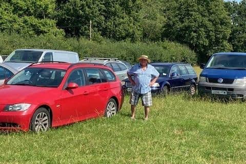 William Lewis In His Field With Cars For Ukraine, Portrait. (Credit Christine Godfrey)