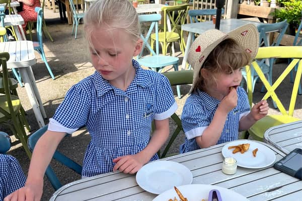 Enjoying freshly cooked chips from the freshest potatoes!