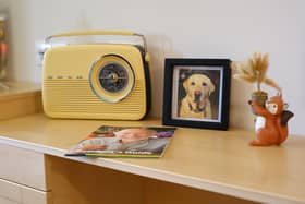 An old radio on a residents desk.
