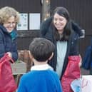 Staff and children enjoying their Christmas fair, taking part in the lucky dip.