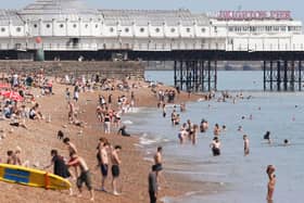 People enjoying the glorious sunshine on Brighton Beach. Photo: Eddie Mitchell